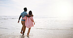 Love, walking and relax with couple at beach for travel destination, summer and honeymoon vacation. Back, tropical and adventure with woman on date for holiday, bonding and romance togetherr