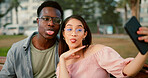 Funny, selfie and couple on bench in park with silly memory, social media post and interracial relationship. Love, photography and happy man with woman on romantic date with outdoor bonding together