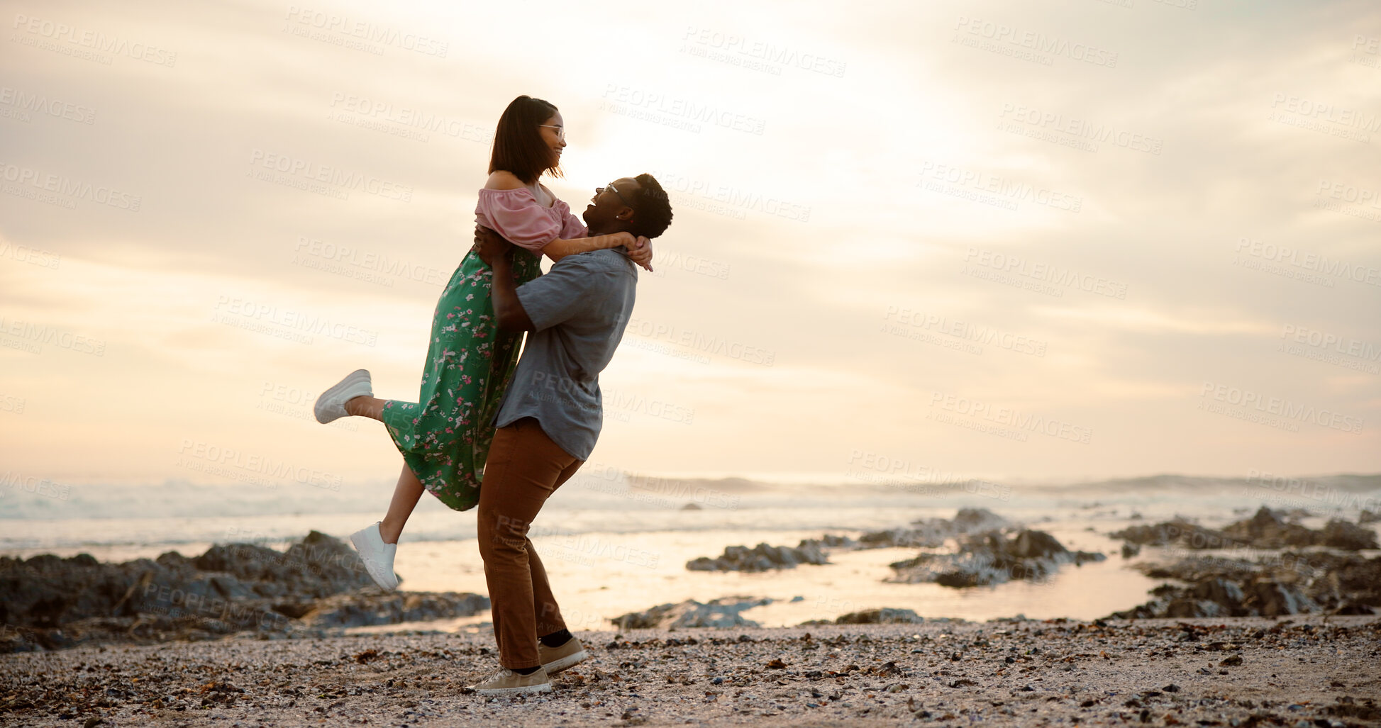 Buy stock photo Beach, dance and couple with love and bonding together with happiness, travel and romance. Interracial, seaside and man with woman, movement and relationship with getaway trip, embrace and adventure