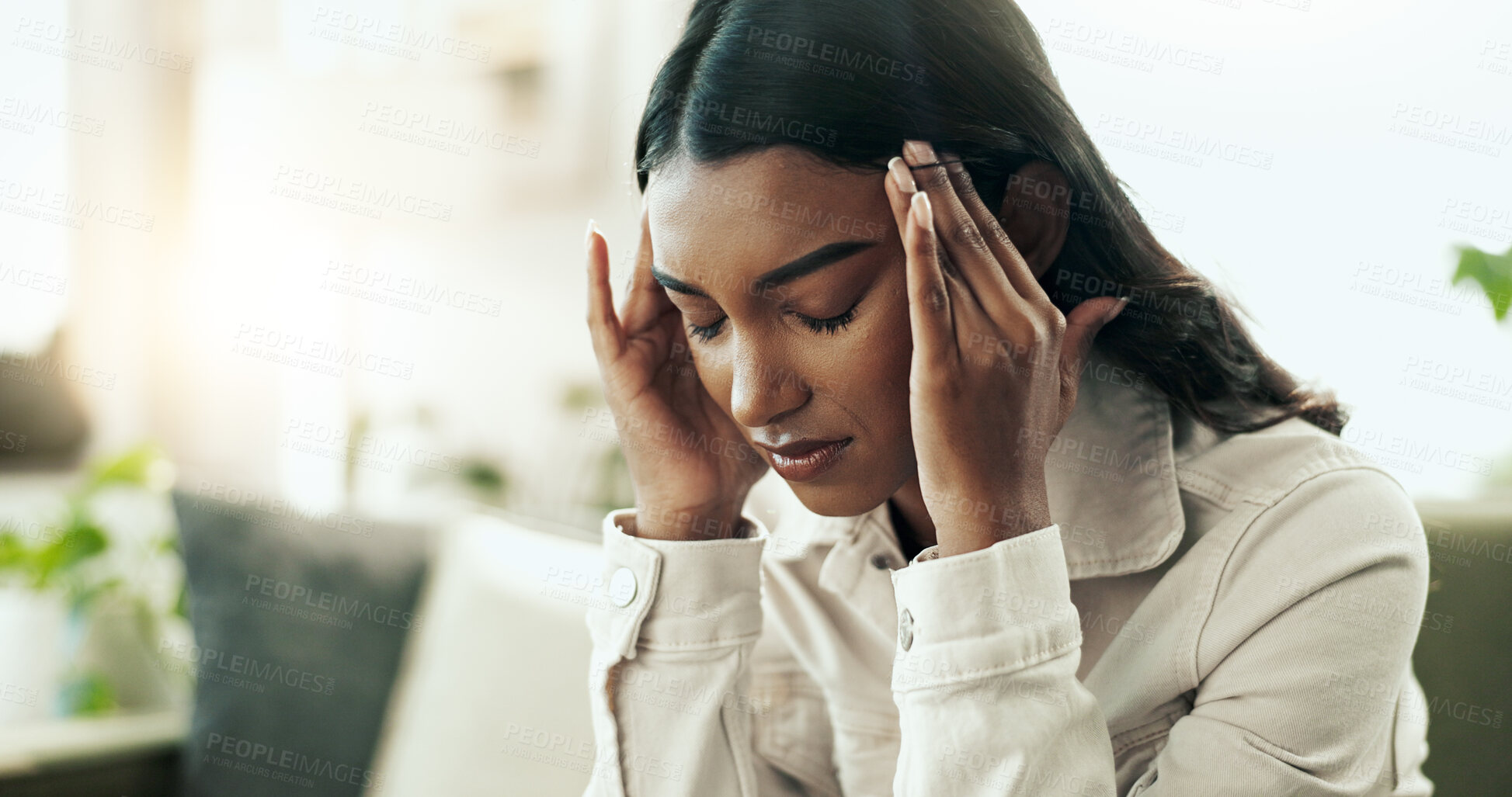 Buy stock photo Indian woman, stress and headache in home for pain, burnout and depression on sofa with head massage. Female person, sad and anxiety in apartment for mental health, fatigue or migraine with brain fog