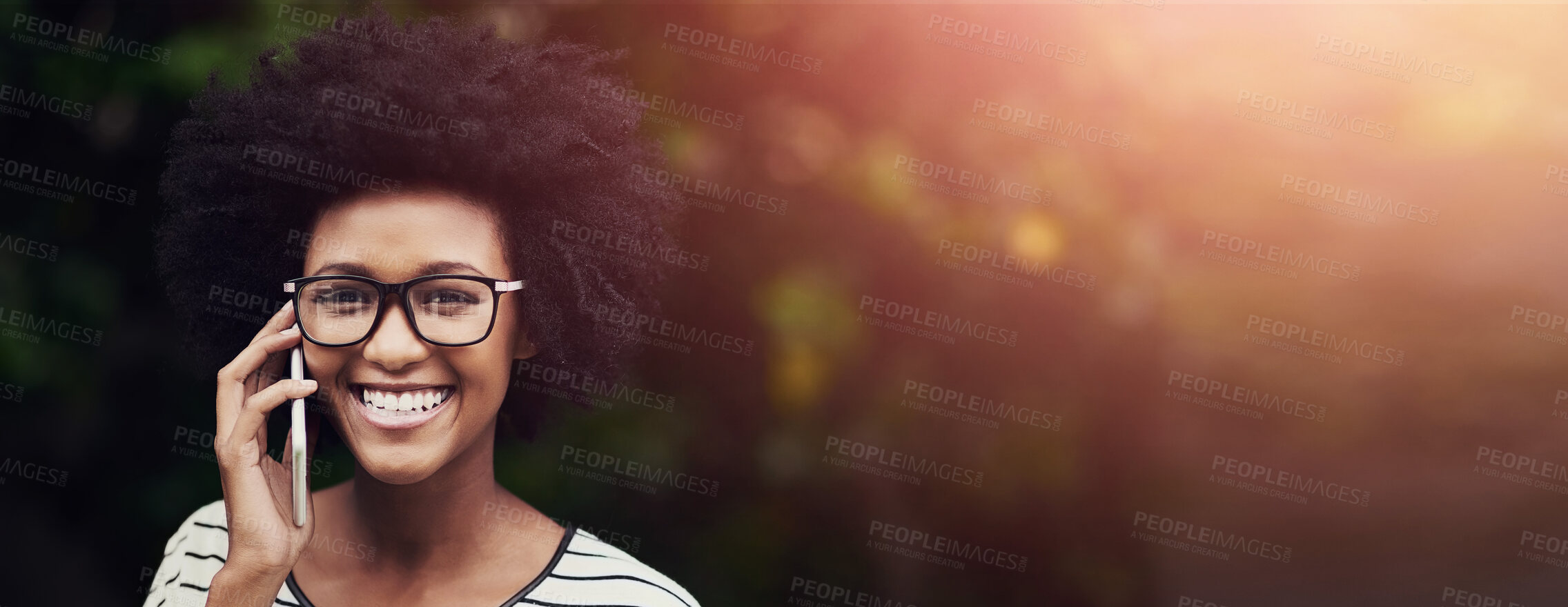 Buy stock photo Portrait of a happy young woman using her phone outdoors