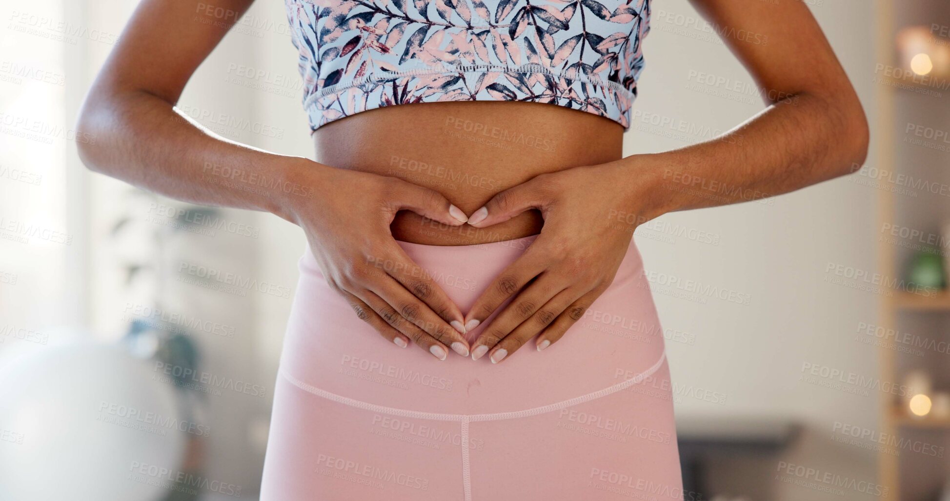 Buy stock photo Woman, heart and hands on stomach for fitness, wellness or body care in home. Love, abdomen or girl with sign for digestion, gut health and show progress of keto diet or detox for weight loss results