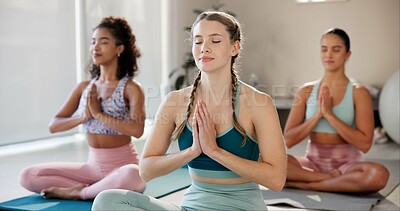 Buy stock photo Meditation, mindfulness and class with women in studio for health, zen and wellness. Yoga balance, spiritual and healing aura with people and holistic practice for relax, awareness or energy