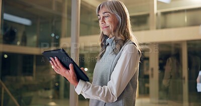 Buy stock photo Business, night and  senior woman with tablet in office, app and internet with company website, network and email. Person, evening and consultant with technology, research for project and connection