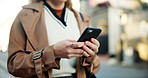 Woman, phone and hands in street to travel with taxi app, transport and morning commute in city. Professional, person and smartphone for cab location, trip details and ride service on road sidewalk