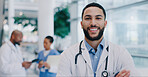 Doctor, man and arms crossed with smile in portrait at hospital with pride for medical career. Person, happy and healthcare professional in corridor at clinic for wellness, services and job in Mexico