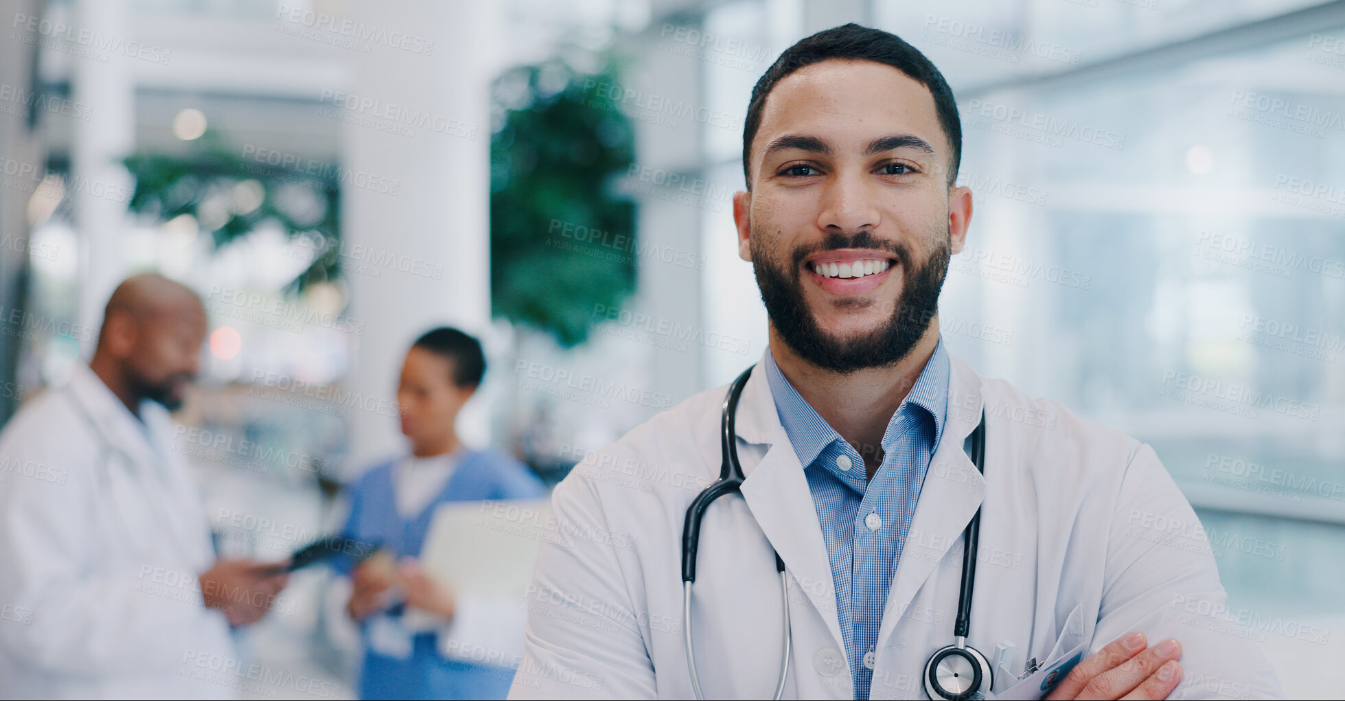 Buy stock photo Doctor, man and arms crossed with smile in portrait at hospital with pride for medical career. Person, happy and healthcare professional in corridor at clinic for wellness, services and job in Mexico