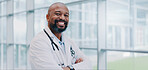 Black man, doctor and confident in hospital for portrait, healthcare and smile for career path. Mature cardiologist, arms crossed and happy in lobby for service, medical expertise and pride in Kenya