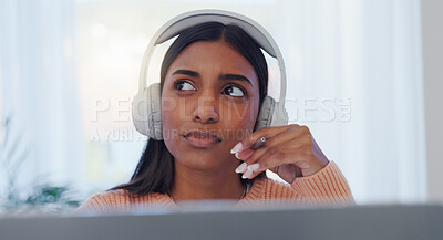 Laptop, music and thinking with Indian woman in home office for online study or remote work. Computer, learning and listening with freelancer in apartment for future planning or problem solving