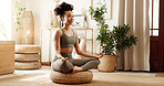 House, yoga and woman with meditation, lotus and peace with chakra, spiritual routine and balance. Apartment, healthy person or girl with posture, calm or zen with exercise or wellness in living room