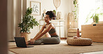 Woman, yoga and stretching by laptop in home with smile, health and warm up for online course in morning. Girl, person and happy with computer, pilates and ready for virtual class on carpet in house