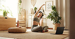 Woman, yoga and stretching arms by laptop on floor in home, health or warm up for online course in morning. Girl, person and happy with computer, pilates or ready for virtual class on carpet in house