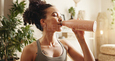 Buy stock photo House, drinking water and woman with fitness, thirsty and wellness with break in lounge. Person, apartment and healthy girl with liquid, aqua and nutrition with diet, balance or routine with bottle