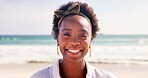 Happy, relax and portrait of black woman at beach for summer vacation, holiday and weekend in nature. Travel, smile and face of person by ocean, sea and outdoors for tourist adventure in Tanzania