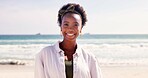 Happy, travel and portrait of black woman at beach for summer vacation, holiday and weekend in nature. Relax, smile and face of person by ocean, sea and outdoors for fun adventure in South Africa