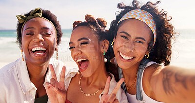 Buy stock photo Happy women, portrait and selfie with emoji at beach for holiday or summer vacation together. Young, group or friends with smile, peace sign or hug in joy for picture, memory or moment by ocean coast