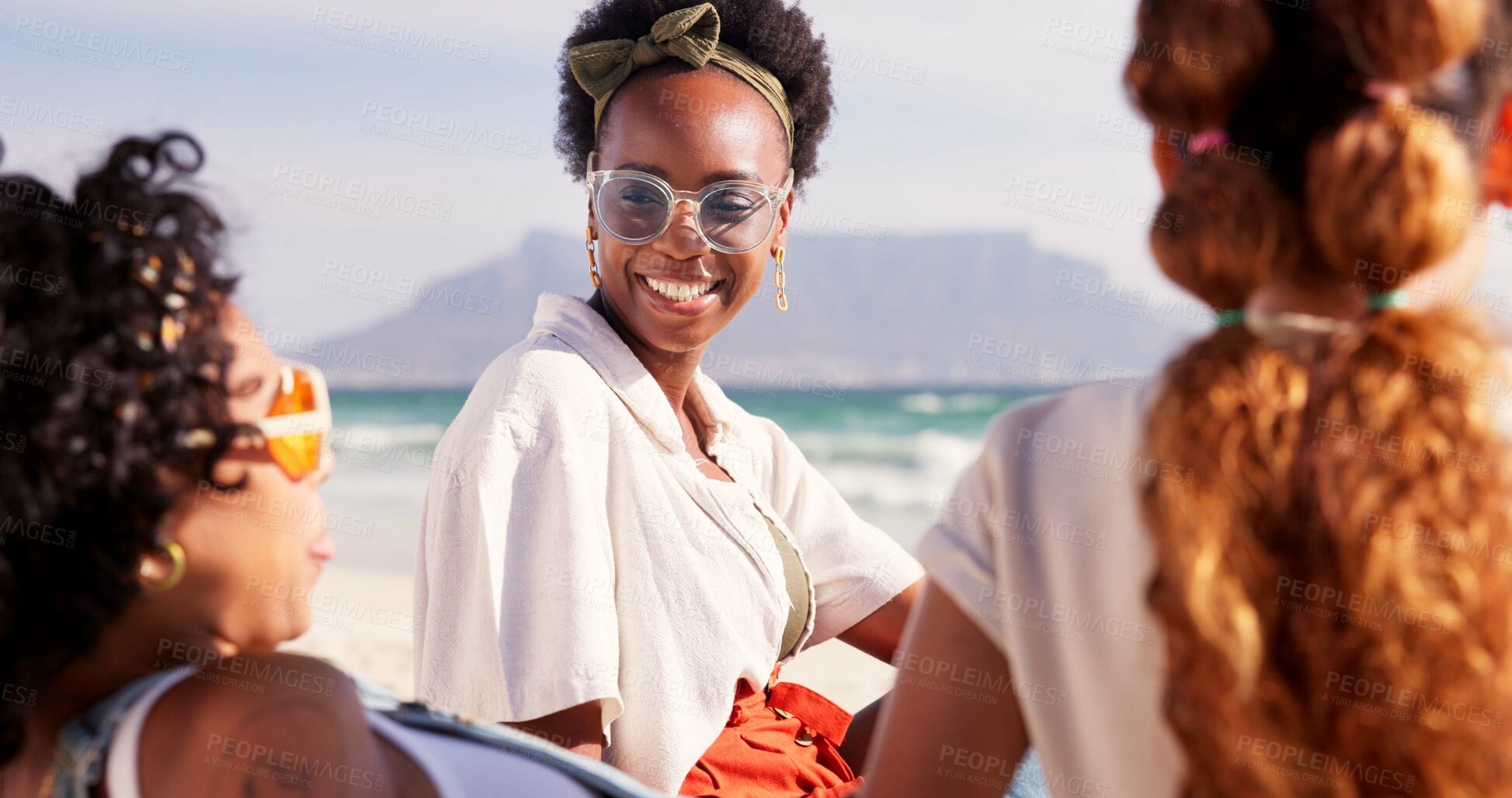 Buy stock photo Friends, travel and happy to relax on beach with conversation, summer holiday and sunglasses. People, group and tropical adventure at ocean for vacation, reunion trip and bonding with talking and fun