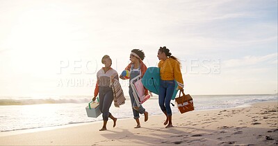 Buy stock photo Happy, picnic and girl friends on beach for weekend trip, vacation or travel with bonding together. Walking, adventure and group of young women laughing by ocean for seaside tropical holiday.