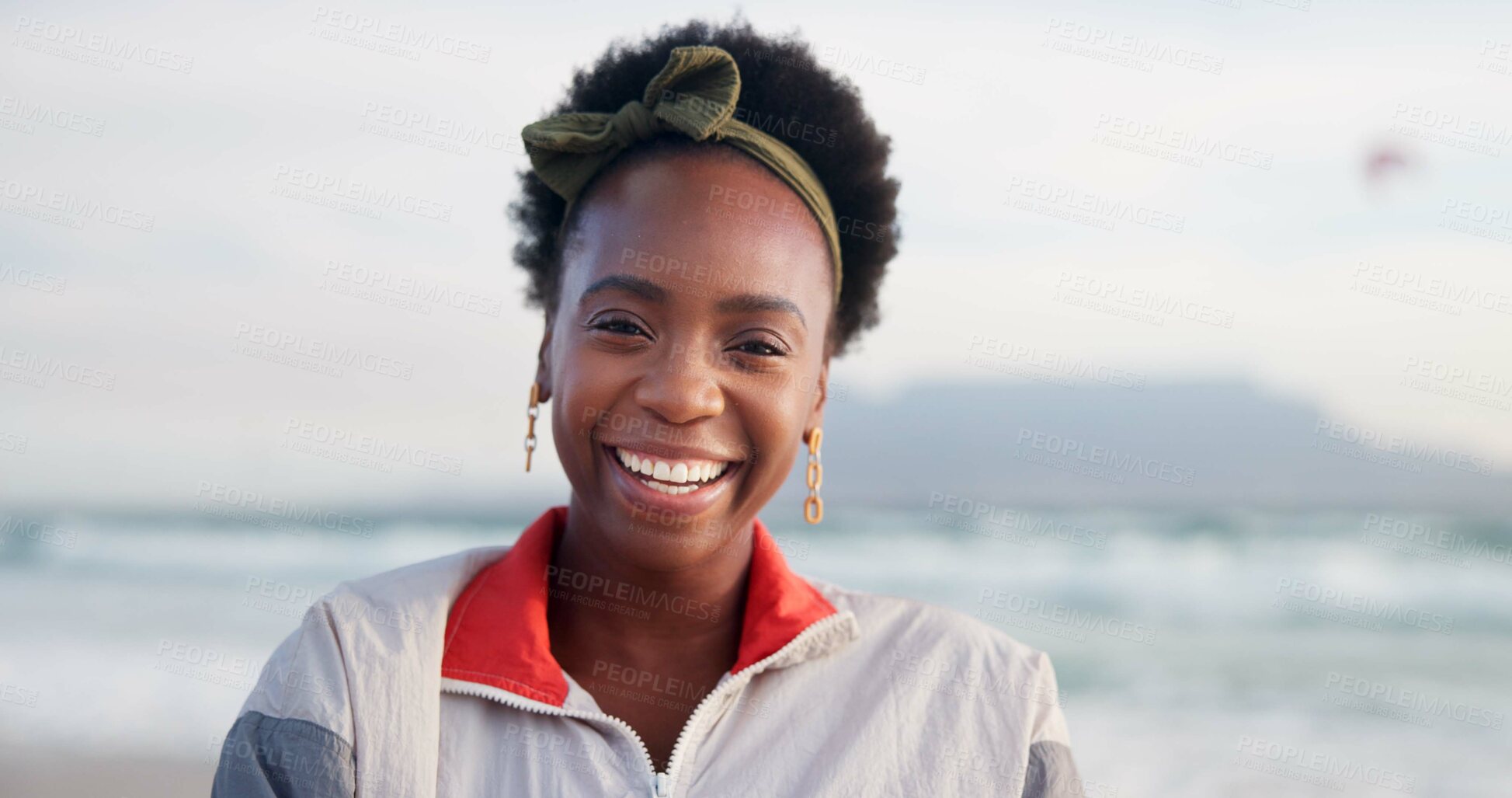 Buy stock photo Happy, laugh and portrait of black woman at beach for summer vacation, holiday and weekend in nature. Travel, smile and face of person by ocean, sea and outdoors for adventure, relax and fun in USA