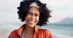 Happy, relax and portrait of woman at beach for summer vacation, holiday and weekend in nature. Travel, smile and face of person by ocean, sea and outdoors for adventure, wellness and fun in Brazil