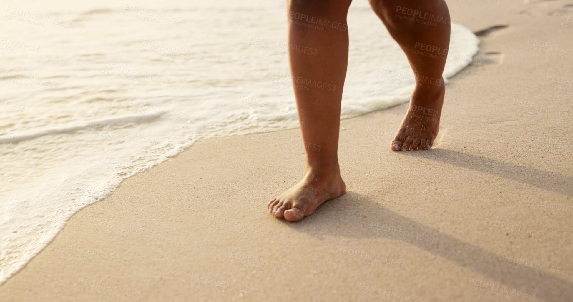 Buy stock photo Person, legs or foot with water on beach, waves or shore for sunny vacation, holiday or weekend getaway in nature. Closeup, walking and feet with sand on ocean coast for outdoor stroll by seaside