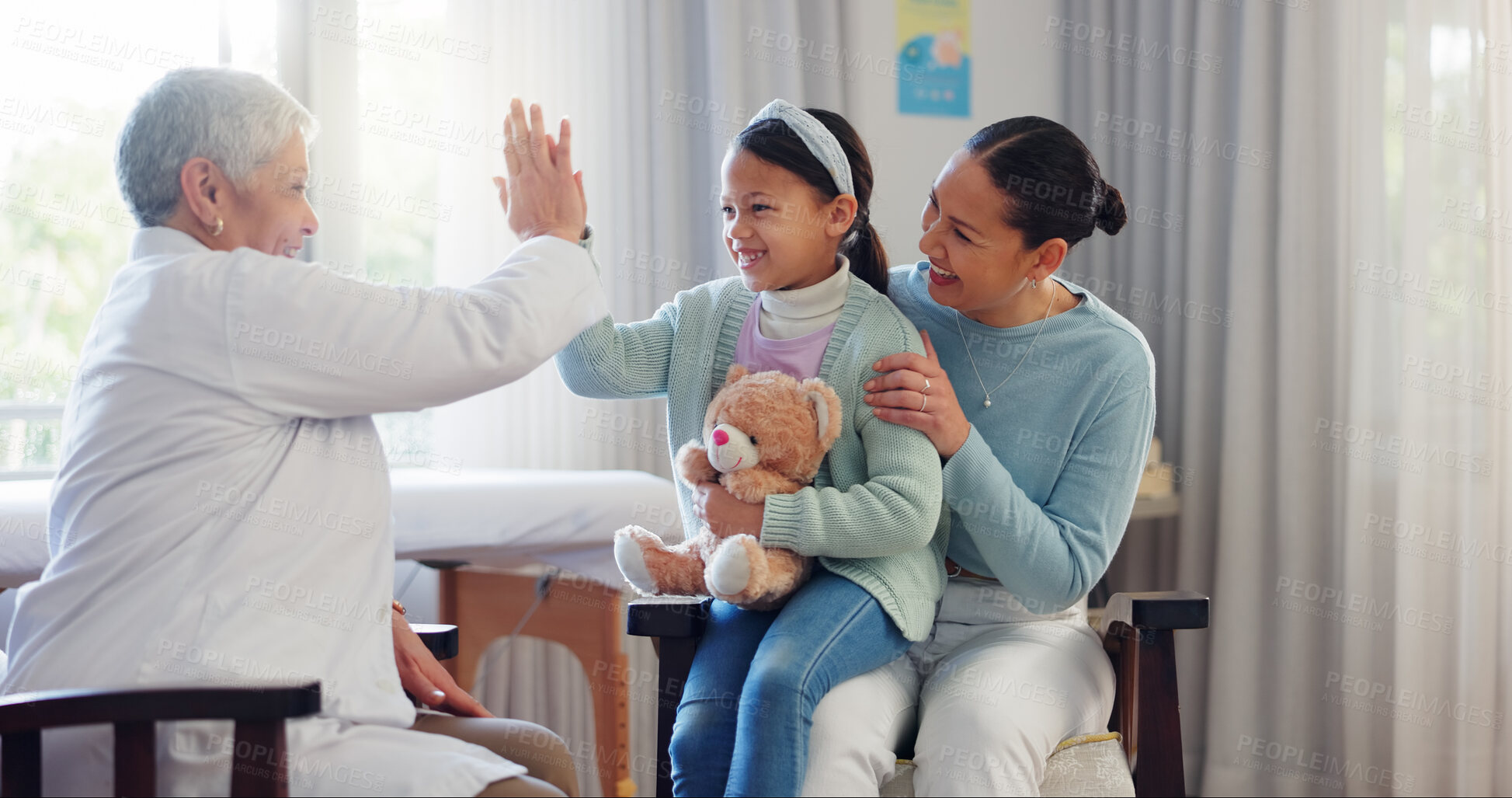 Buy stock photo Pediatrician, child and mom at consultation with high five of mature woman and teddy with health check. Smile, support and healthcare with motivation, young girl and wellness with family doctor