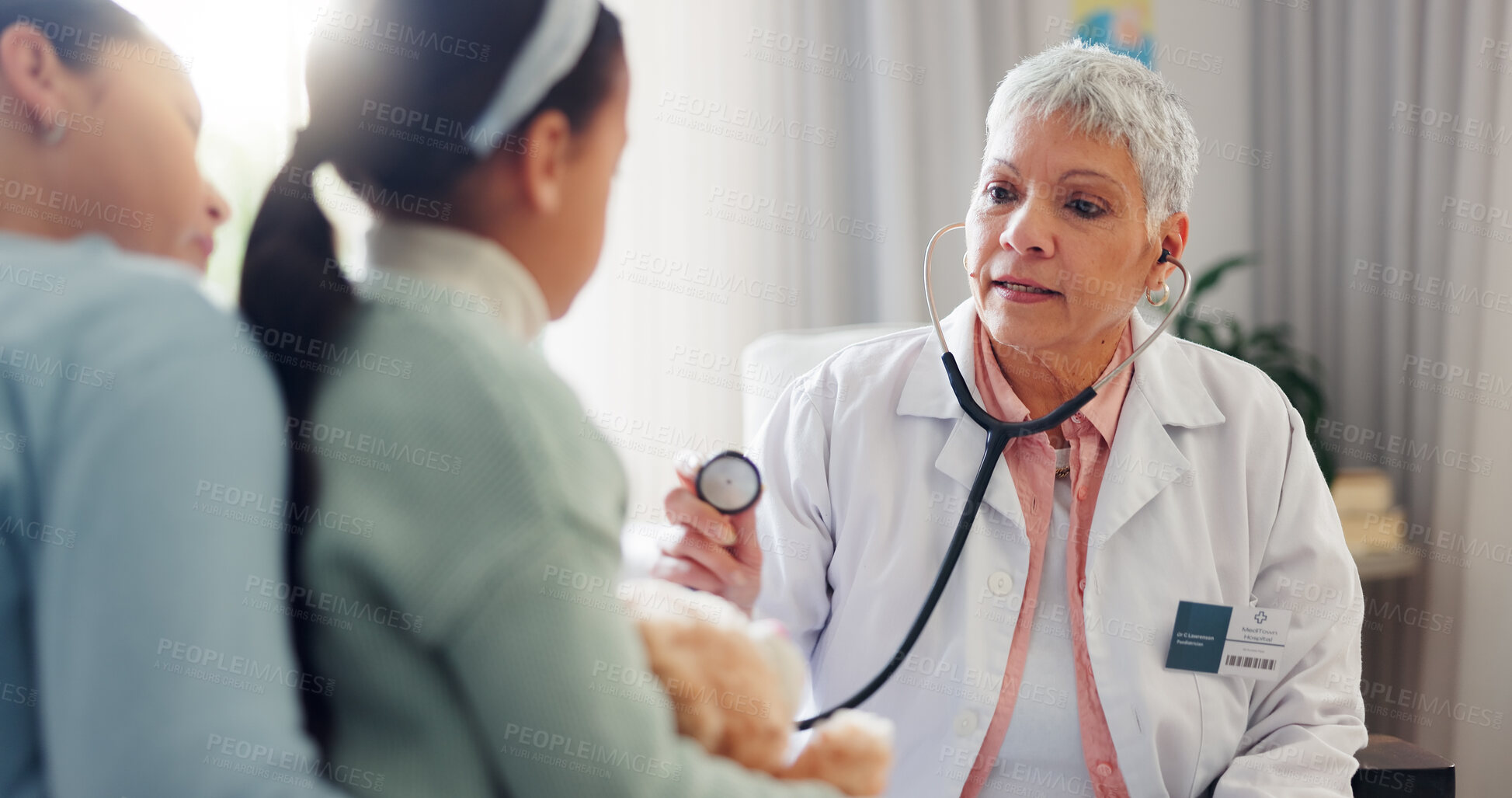 Buy stock photo Hospital, stethoscope and doctor with child listening for consulting, medical service and help in clinic. Healthcare, pediatrician and woman with mom and girl for diagnosis, breathe and wellness