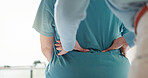 Back pain, physiotherapist and hands of people in office for medical support, exam and injury recovery. Women, physiotherapy and patient with consultation for osteoporosis, rehabilitation or progress