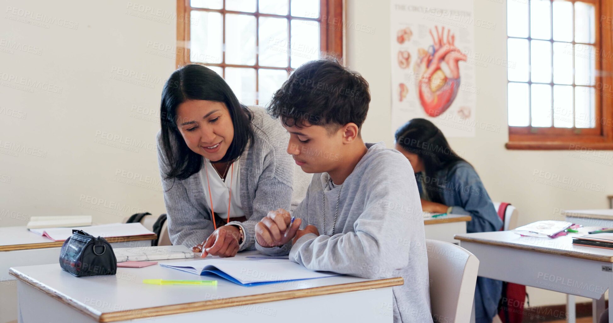 Buy stock photo Happy teacher, student or boy with book for help, support or assistance on question or enquiry at school. Young, male person or educator with learner or teenager in exam, test or classroom assessment