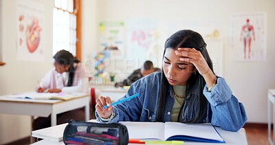 Buy stock photo Frustrated girl, student or book with exam for difficult test, stress or question in classroom at school. Young, female person or teenager with notebook, anxiety or nerves for assesment or assignment