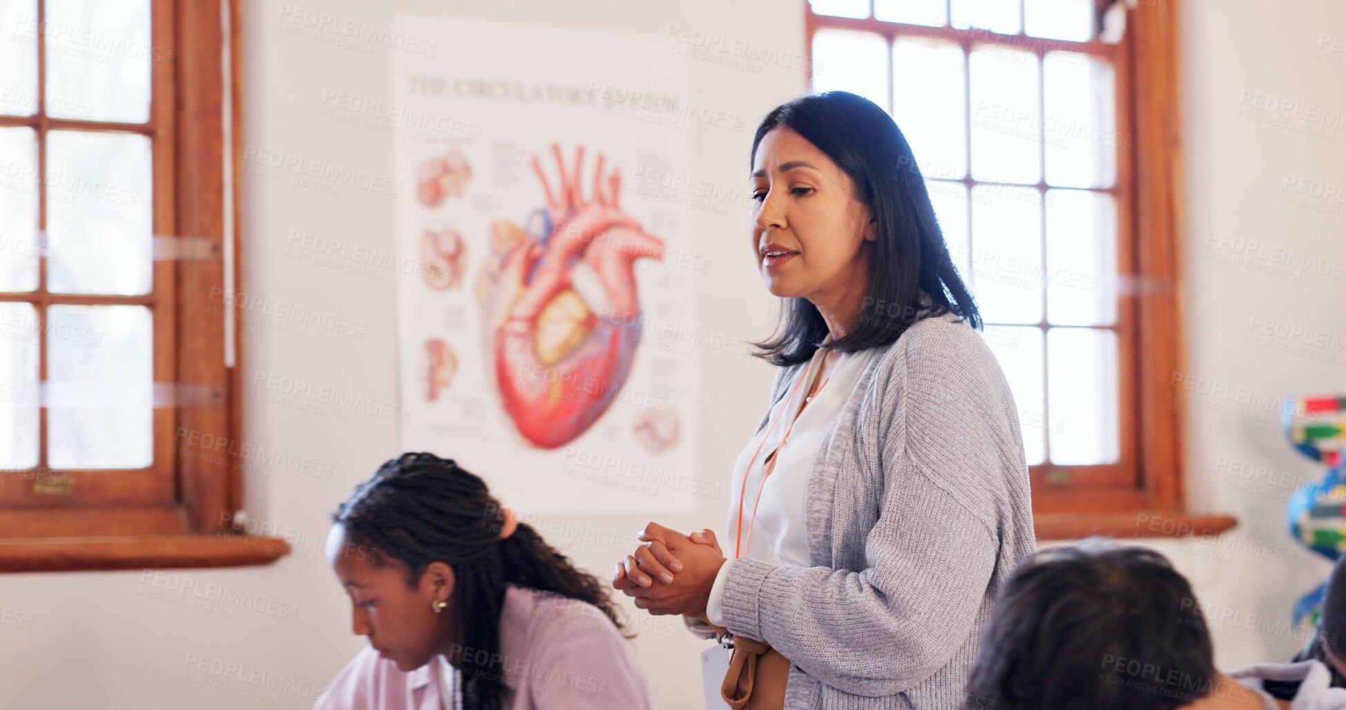 Buy stock photo Education, woman and teacher in classroom at school for teaching students biology for exam. Life science, career and female educator talking in lesson for research, notes or information with test.