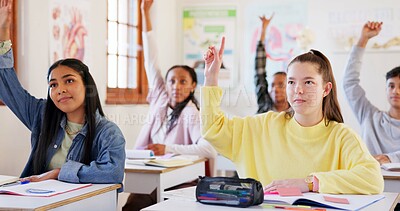 Buy stock photo Happy teenager, students or hands raised with question in classroom for interaction, learning or education at school. Young, group or learners with smile or answer for engagement, quiz or development