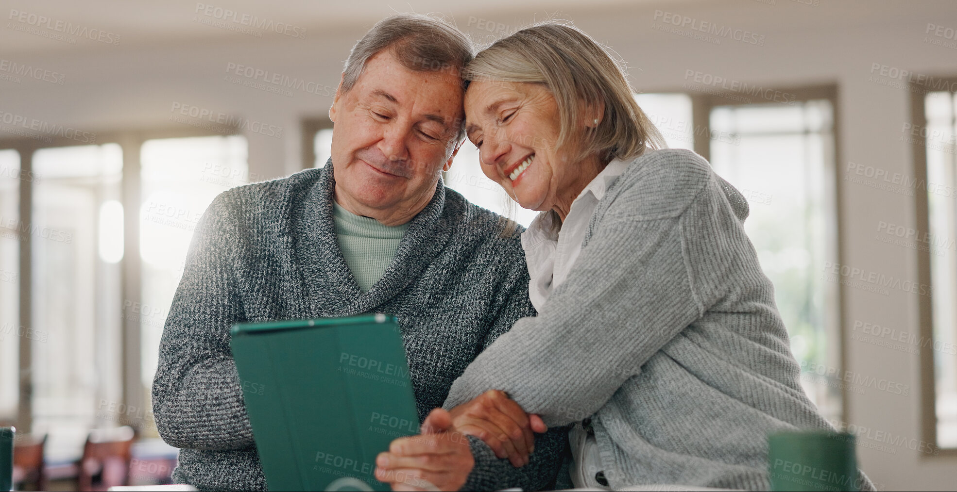 Buy stock photo Senior couple, tablet and home for watching comedy together, hug and relax with subscription. Elderly people, embrace and love in relationship for security, streaming movies and online for comic film