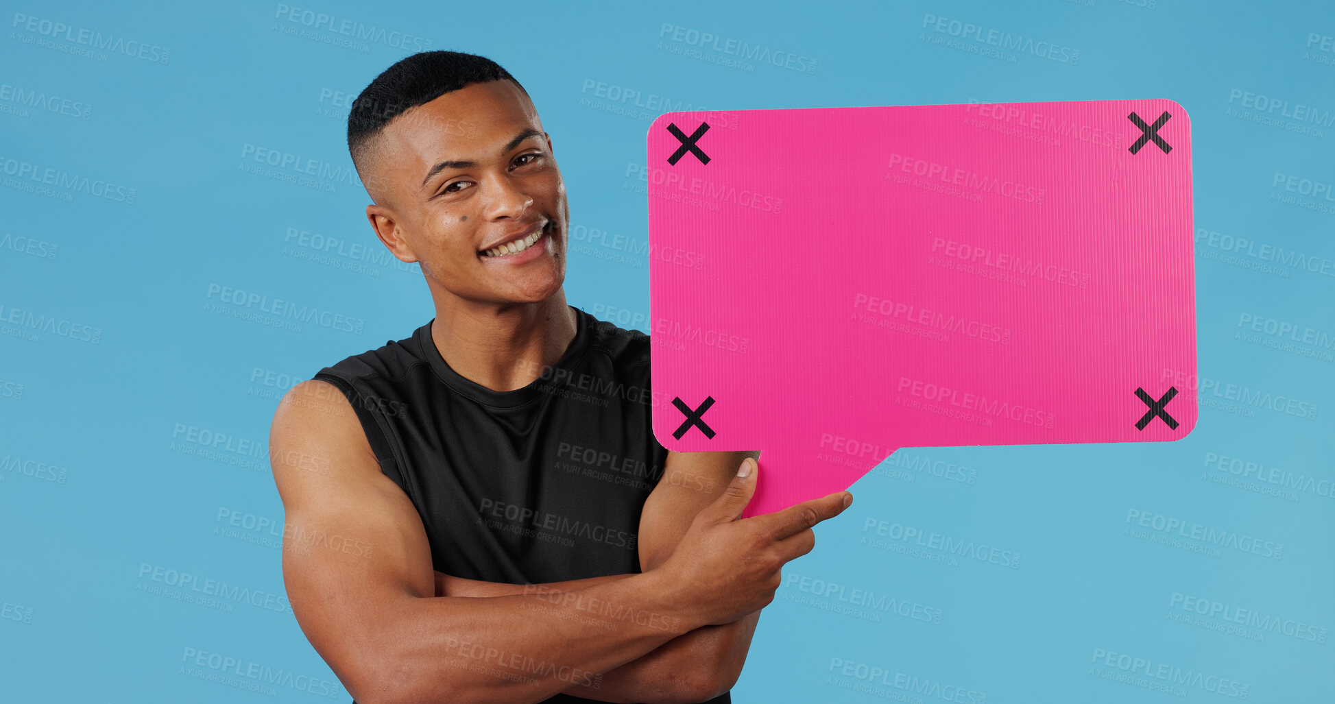 Buy stock photo Man, speech bubble and smile in studio portrait for opinion for gym subscription by blue background. Personal trainer, pink board and sign with mock up space, review or tracking markers in Brazil