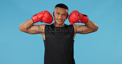 Buy stock photo Man, strong and portrait in studio for box, fight and muay thai with exercise, battle and competition. Boxer, face and athlete flex on blue background for training, fitness and workout with mma sport