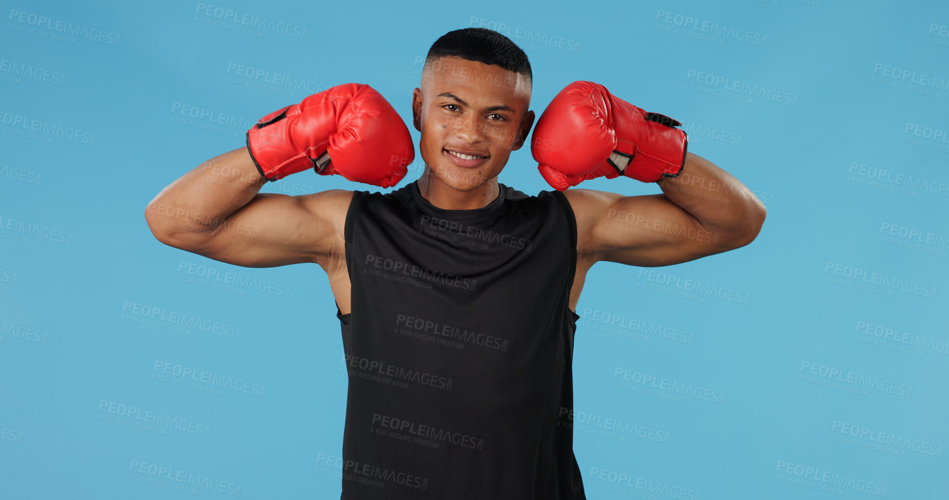 Buy stock photo Man, strong and portrait in studio for box, fight and muay thai with exercise, battle and competition. Boxer, face and athlete flex on blue background for training, fitness and workout with mma sport