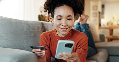 Buy stock photo Phone, credit card and African woman on home couch with online shopping, deal and payment. Living room, sale and relax with internet bank app and ecommerce with digital purchase and mobile with smile