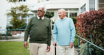 Senior men, together and bonding in retirement home as pensioner for activity, walk and relax. People, elderly care and friends for outdoor in garden, park or backyard in nursing village or community