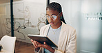 Black woman, coordinator and reading with tablet or glasses for strategy, ideas or research at office. Young African, female person or employee with technology for online browsing or app at workplace