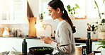 Phone, cooking and woman in kitchen with smile, healthy food and online recipe for lunch. Diet, nutrition and happy girl with smartphone, research and website for dinner meal prep advice in home