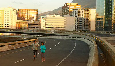 Buy stock photo Urban, workout and couple on street running together for sports training, commitment and body health. Evening, man and woman on road for fitness, exercise or outdoor wellness challenge on city bridge