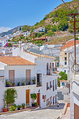 Buy stock photo Road, town and outdoor architecture on vacation, Europe summer and historical culture on getaway. Street, city and traditional buildings in destination, location and urban holiday in Frigiliana