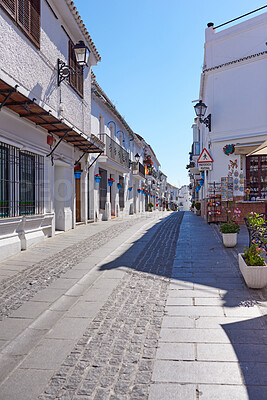 Buy stock photo Urban street, travel and alley with holiday destination, texture and background in town or city. Wallpaper, outdoor and cobblestone in neighborhood for tourism, adventure or sightseeing for journey