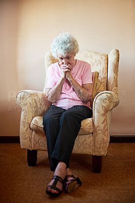 Buy stock photo Shot an elderly woman looking worried