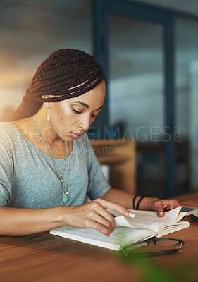 Buy stock photo Woman, night and reading with book on desk for literature, story or novel at office. Young African, female person or employee working late or studying research for knowledge or business information