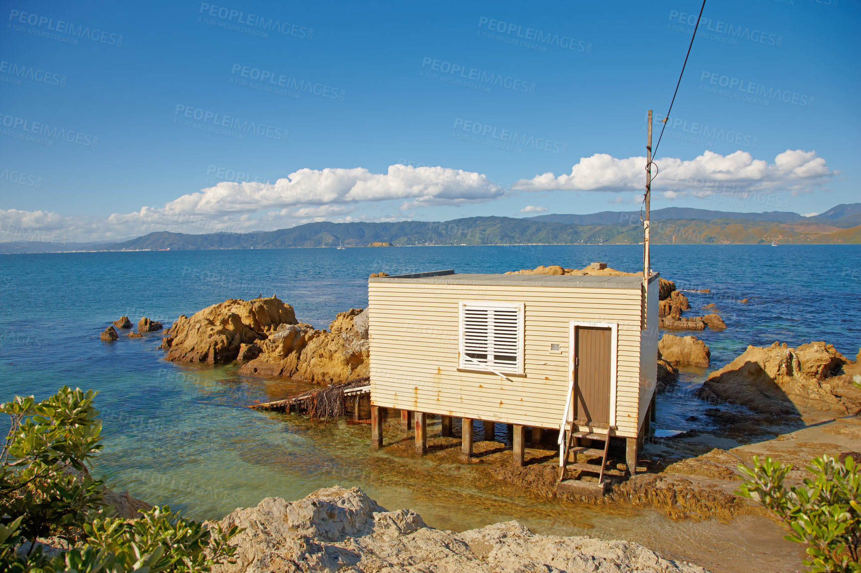 Buy stock photo Architecture, cabin and building on ocean outdoor for summer vacation, travel location and destination. Home, structure and coast cottage with nature, blue sky and holiday getaway on water in Miami