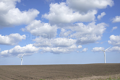 Buy stock photo Clouds, landscape and sky with wind turbine for renewable energy outdoor to produce electricity. Earth, nature and recycling with windmill in nature environment for conservation or power supply