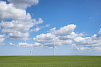 Clouds, nature and sky with wind turbine for renewable energy outdoor to produce electricity. Earth, landscape and recycling with windmill in nature environment for conservation or power supply