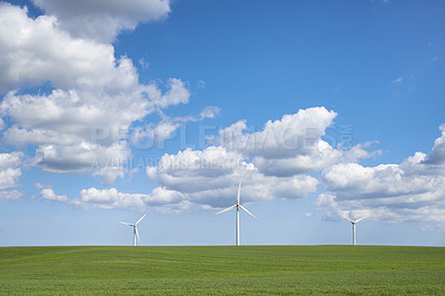 Buy stock photo Clouds, nature and sky with wind turbine for renewable energy outdoor to produce electricity. Earth, landscape and recycling with windmill in nature environment for conservation or power supply