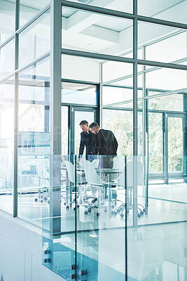 Buy stock photo Full length shot of two corporate businessmen meeting in the boardroom